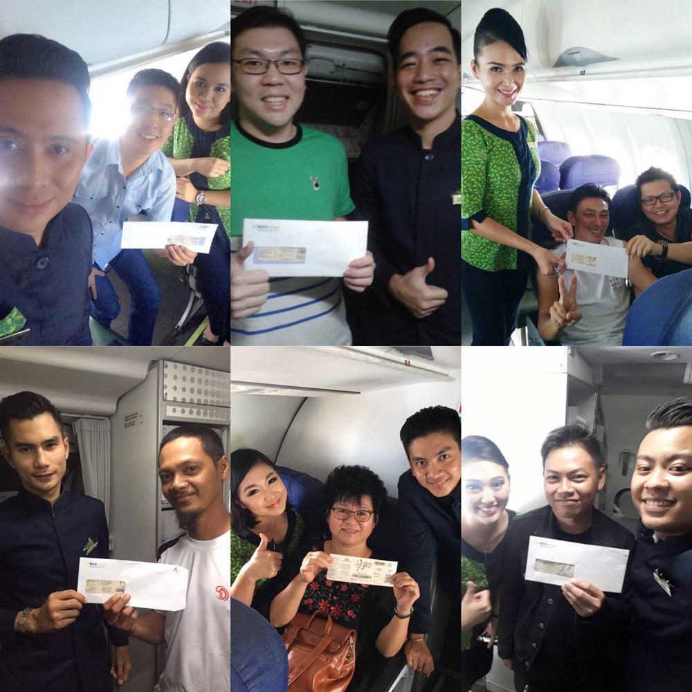 Image shows MASwings staff awarding passengers with tickets to Borneo Jazz Festival in Miri, after holding lucky draws on-board its flights in April.