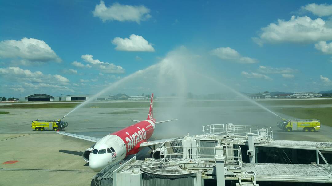 Image shows inaugural flight receiving water salute at Kuching International Airport.