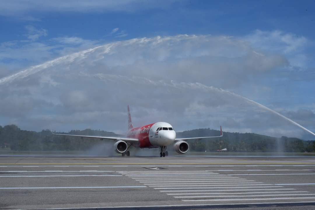 The arrival of the Kuching-Langkawi flight being officially welcomed by water salute at the Kuching International Airport