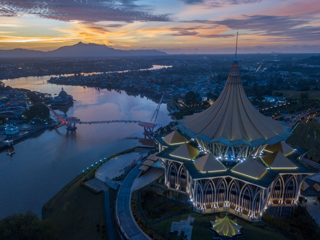 Overlooking the Darul Hana Bridge and the DUN at sunset, opposite the Kuhcing Waterfront