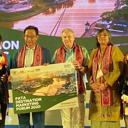 Photo shows Datuk Abdul Karim Rahman Hamzah (left) with PATA CEO, Dr Mario Hardy (centre) and Sarawak Tourism Board, Chief Executive Officer, Sharzede (right) displaying the promotional placard for the forum.
