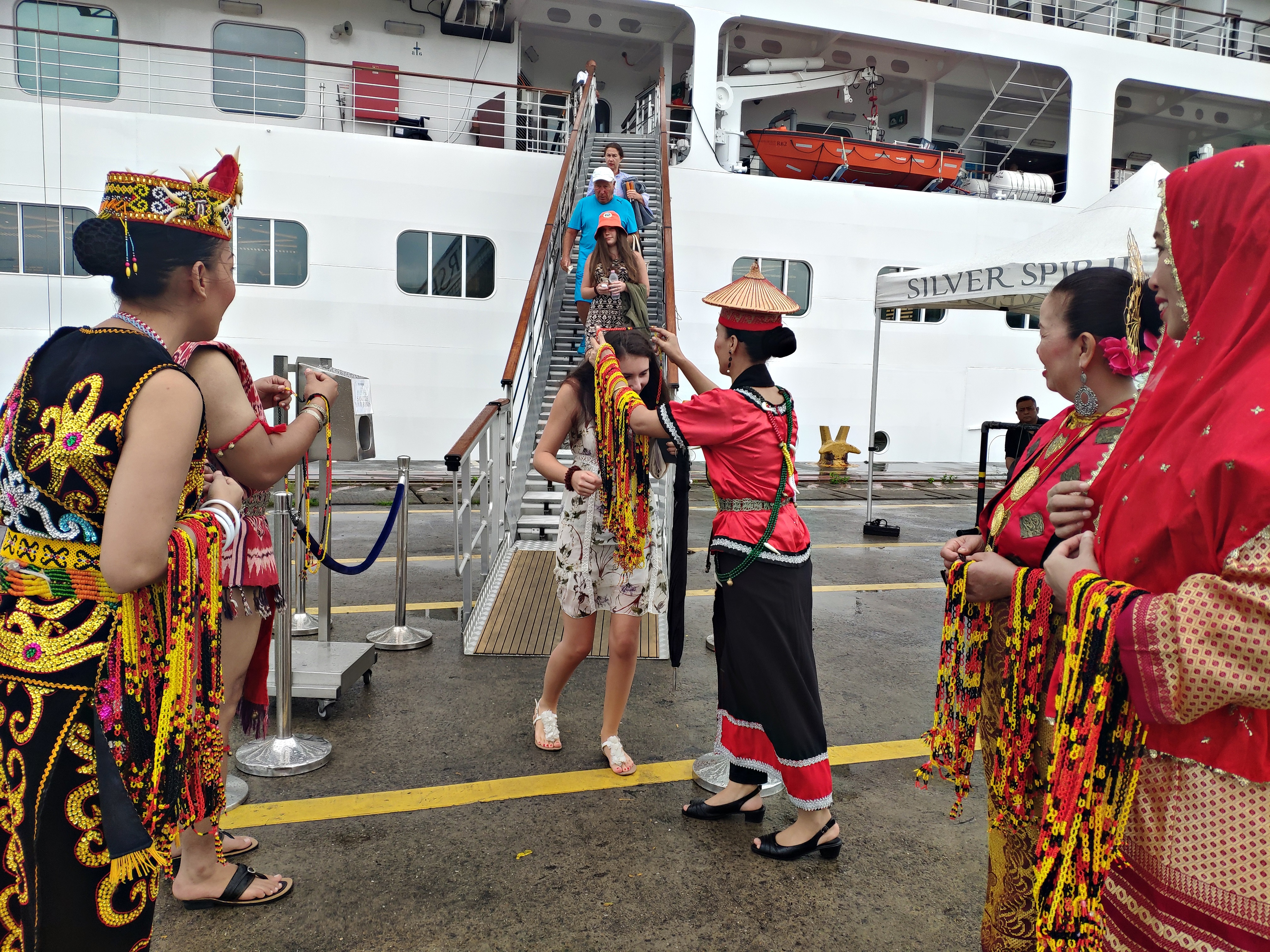 Photo shows one of the passengers accorded with a Sarawak traditional cultural welcoming and garlanding, sponsored by the Sarawak Tourism Board.