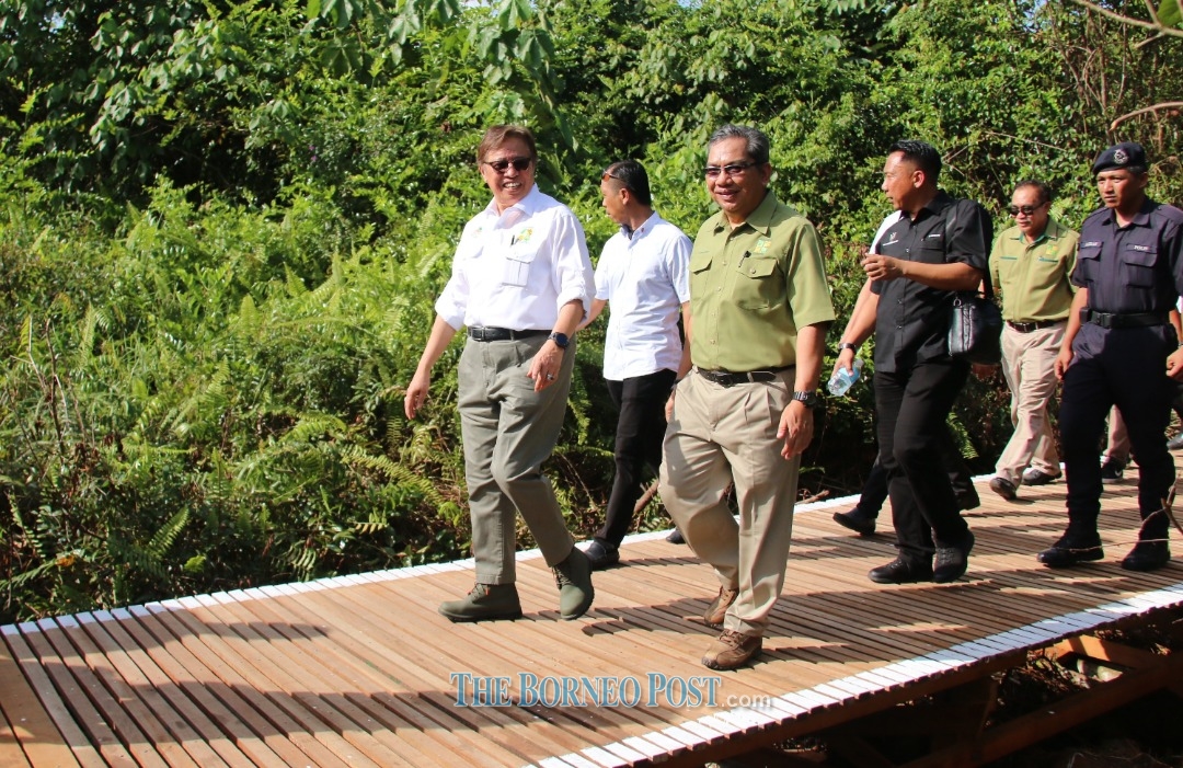 Photo shows Chief Minister of Sarawak, Datuk Patinggi Abang Johari Tun Openg (left), Chief Executive Officer of Sarawak Forestry Corporation (SFC) Zolkipli Mohamad Aton (right) and others walking along the trail at BLNR. (Photo by The Borneo Post)